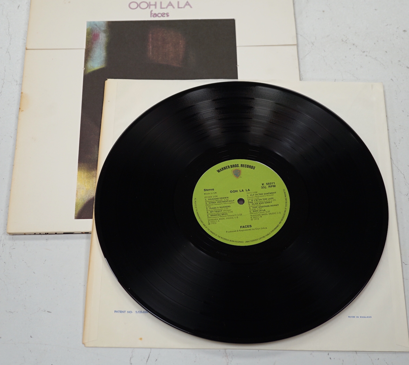 A Faces record LP album; Ooh La La, on green Warner Bros label, K 56011, with ‘Can Can’ picture to reverse label, with original lyric poster, and in die-cut fold-out sleeve